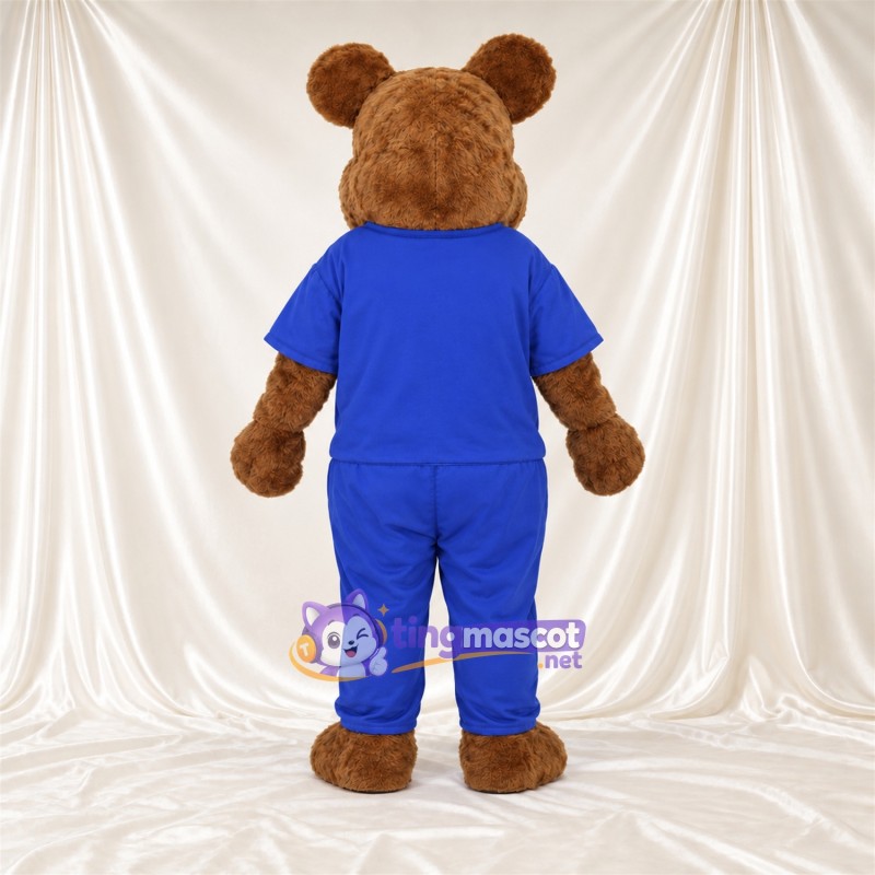 Maskottchenkostüm Bär – braun – Outfit (blau) Maskottchenkostüm Bär – braun – Outfit (blau)
