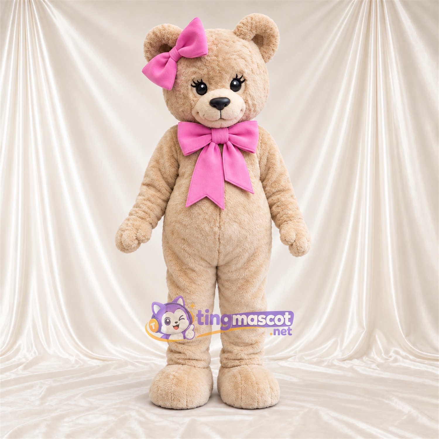 Maskottchenkostüm Bär – hellbraun – Schleifen (rosa) Maskottchenkostüm Bär – hellbraun – Schleifen (rosa)
