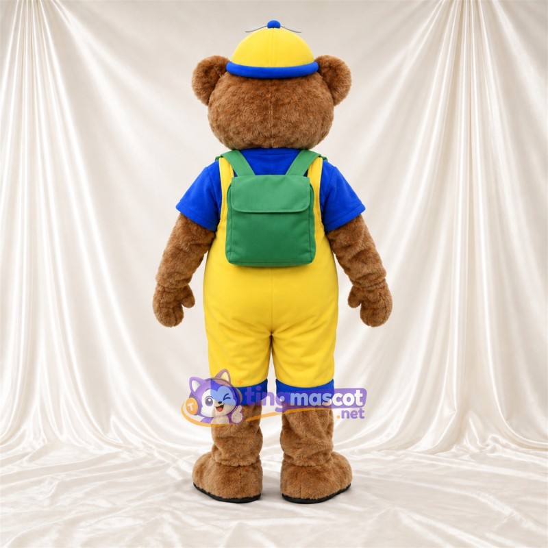 Maskottchenkostüm Bär – braun – Latzhose (gelb); Rucksack Maskottchenkostüm Bär – braun – Latzhose (gelb); Rucksack