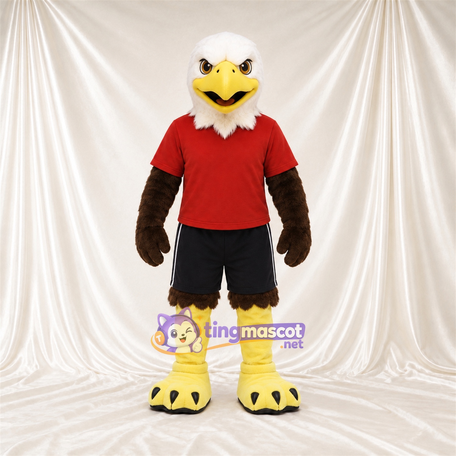 Maskottchenkostüm Adler – braun – Hemd (rot); Shorts (schwarz) Maskottchenkostüm Adler – braun – Hemd (rot); Shorts (schwarz)