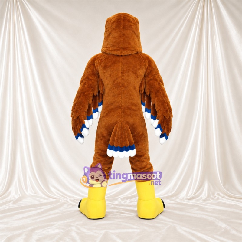 Costume de mascotte Aigle – marron – Pieds (jaune); Bouts des ailes (bleu) Costume de mascotte Aigle – marron – Pieds (jaune); Bouts des ailes (bleu)