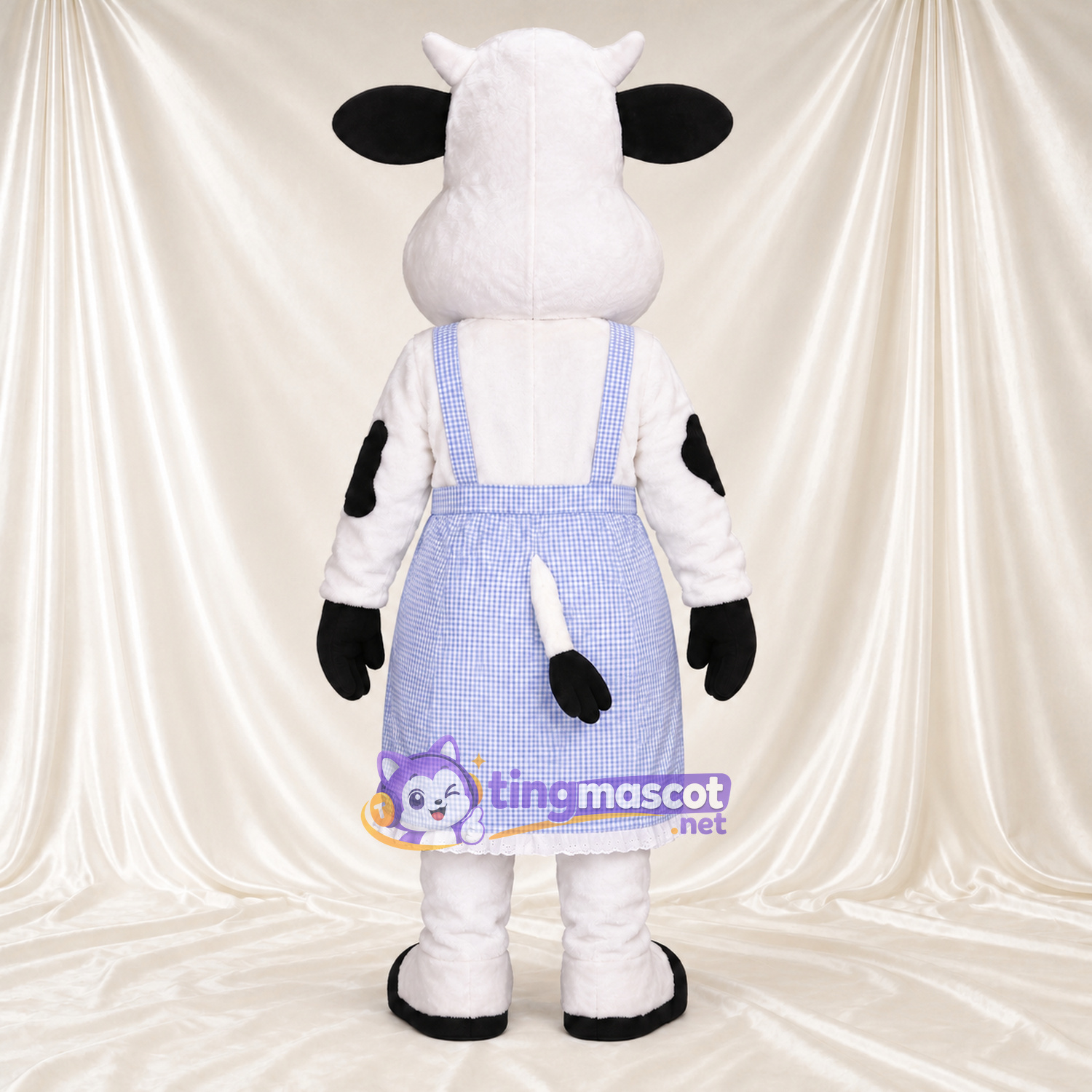 Maskottchenkostüm Kuh – schwarz / weiß – Schürze (violett) Maskottchenkostüm Kuh – schwarz / weiß – Schürze (violett)