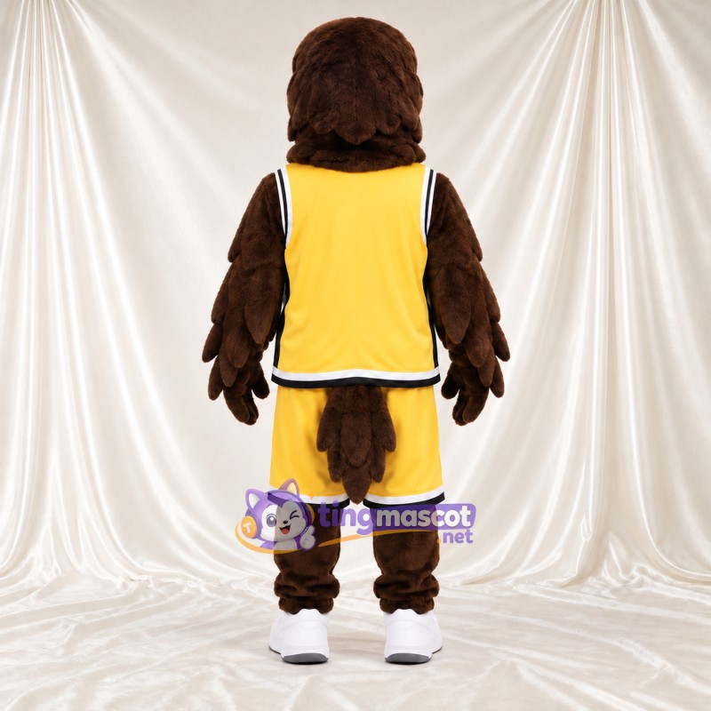 Maskottchenkostüm Adler – braun – Sporttrikot (gelb) Maskottchenkostüm Adler – braun – Sporttrikot (gelb)