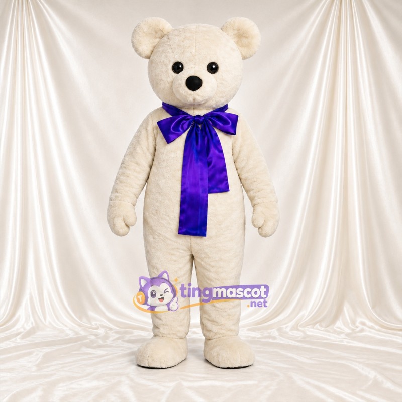 Maskottchenkostüm Bär – creme – Schleife (violett) Maskottchenkostüm Bär – creme – Schleife (violett)