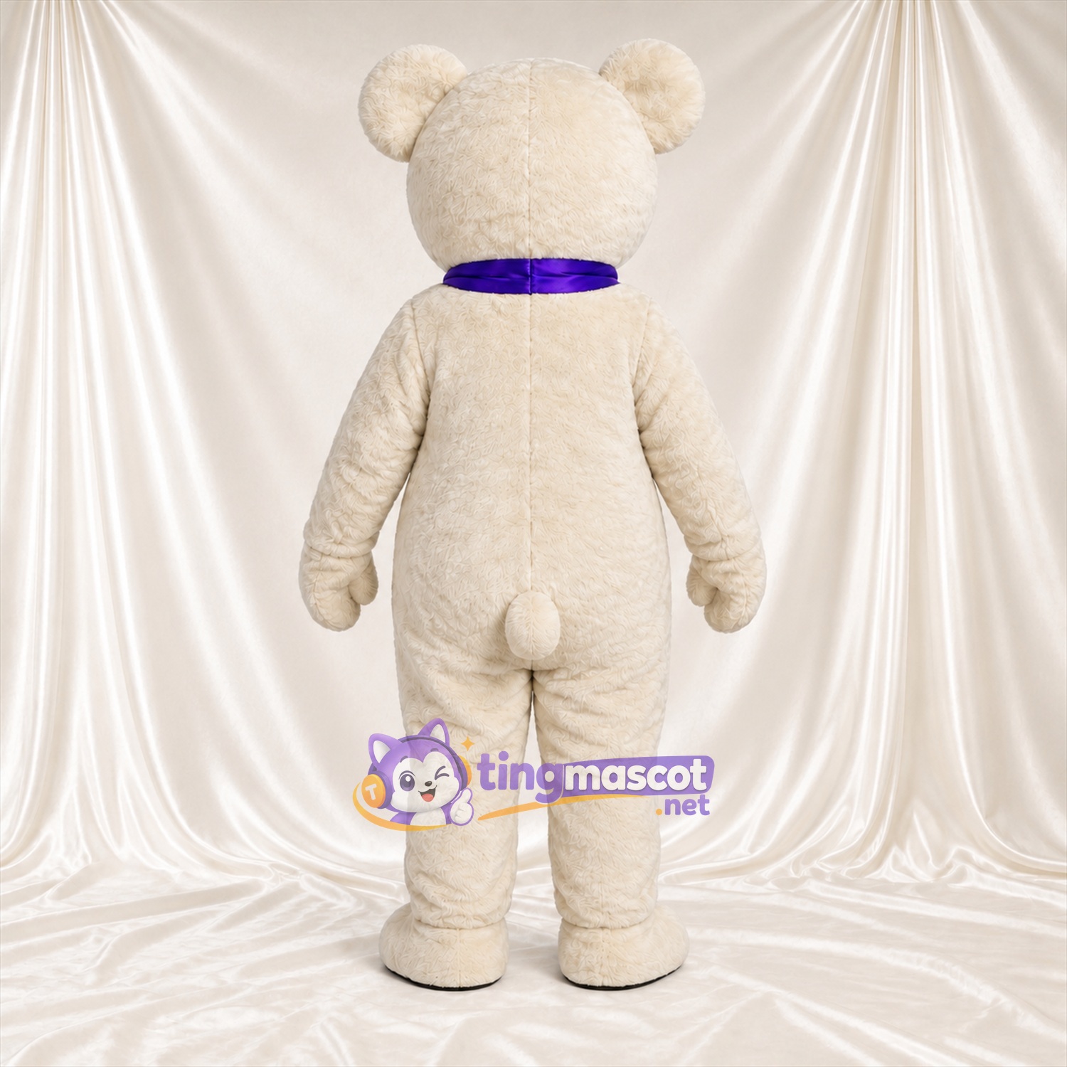 Maskottchenkostüm Bär – creme – Schleife (violett) Maskottchenkostüm Bär – creme – Schleife (violett)