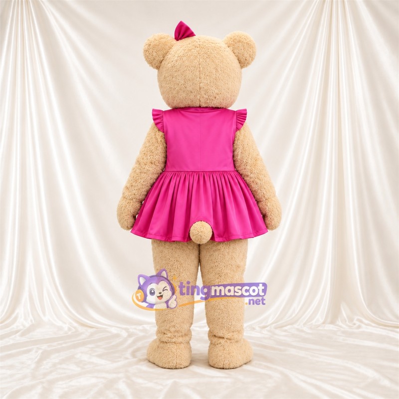 Maskottchenkostüm Bär – hellbraun – Kleid (rosa); Schleife Maskottchenkostüm Bär – hellbraun – Kleid (rosa); Schleife