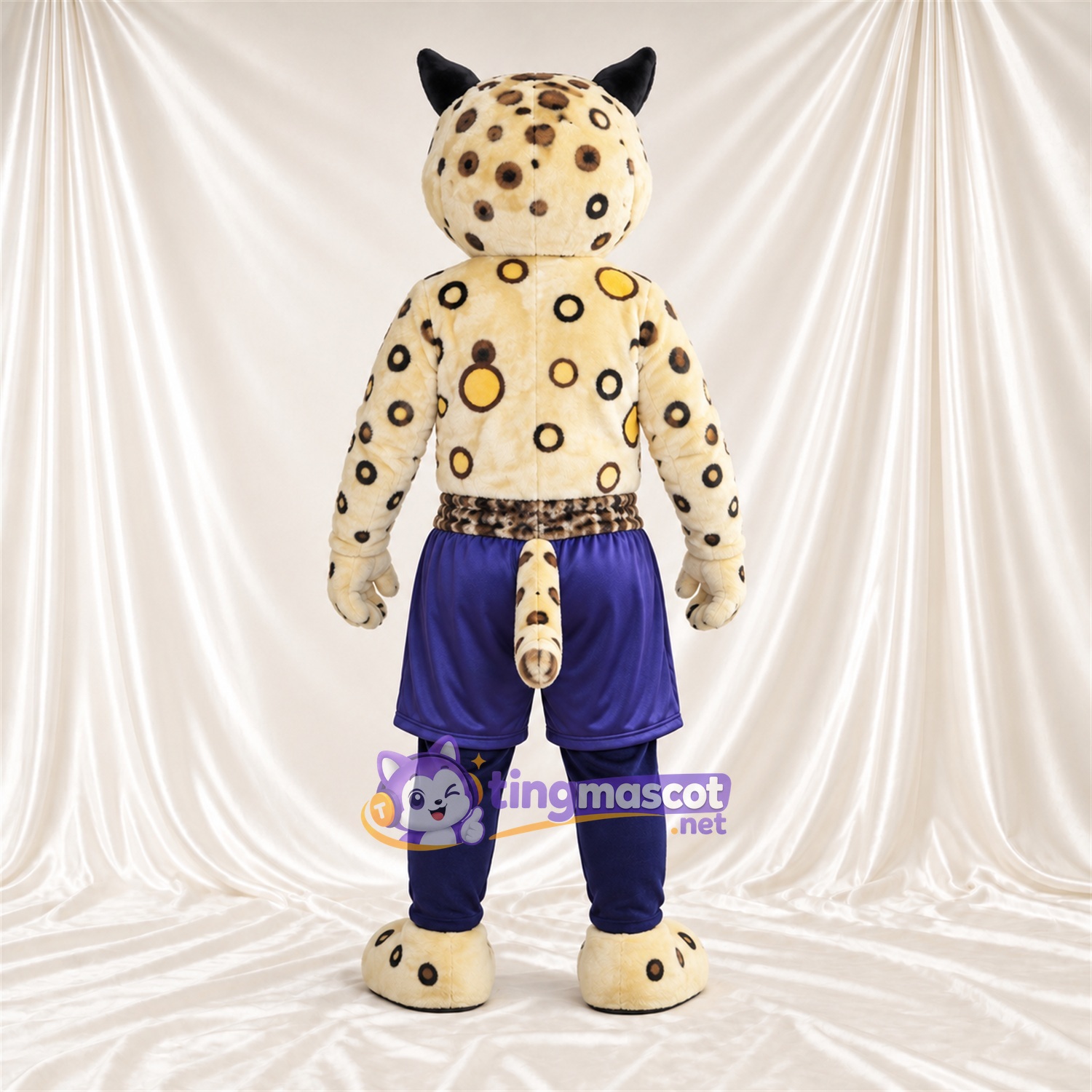 Maskottchenkostüm Leopard – creme / schwarz – Shorts (violett) Maskottchenkostüm Leopard – creme / schwarz – Shorts (violett)