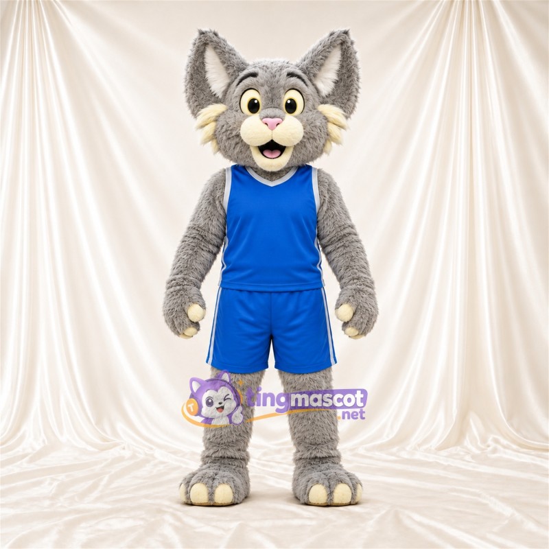 Costume de mascotte Chat sauvage – gris / blanc – Tenue de basket (bleu) Costume de mascotte Chat sauvage – gris / blanc – Tenue de basket (bleu)