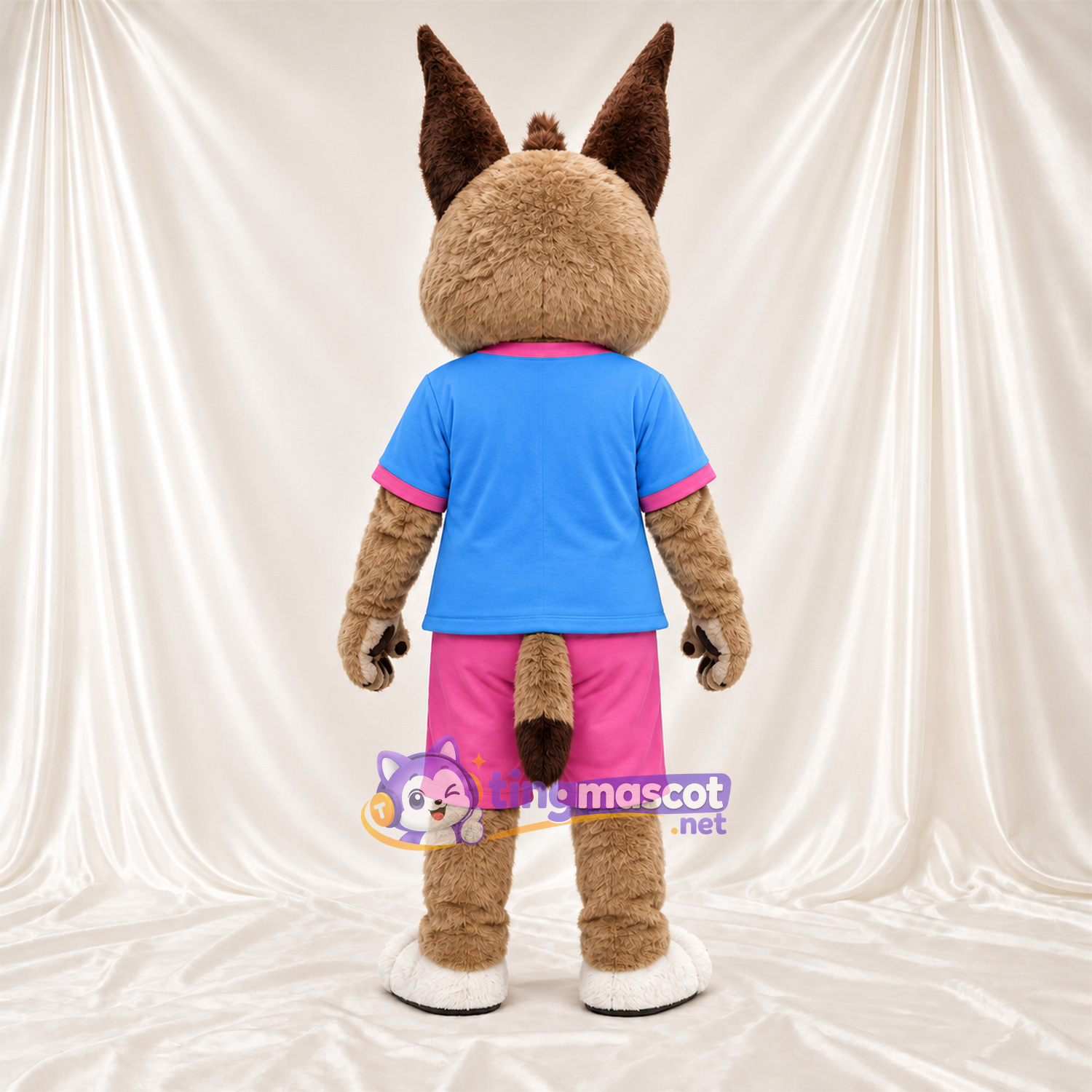 Costume de mascotte Lynx – brun clair – Chemise (bleu); Short (rose) Costume de mascotte Lynx – brun clair – Chemise (bleu); Short (rose)