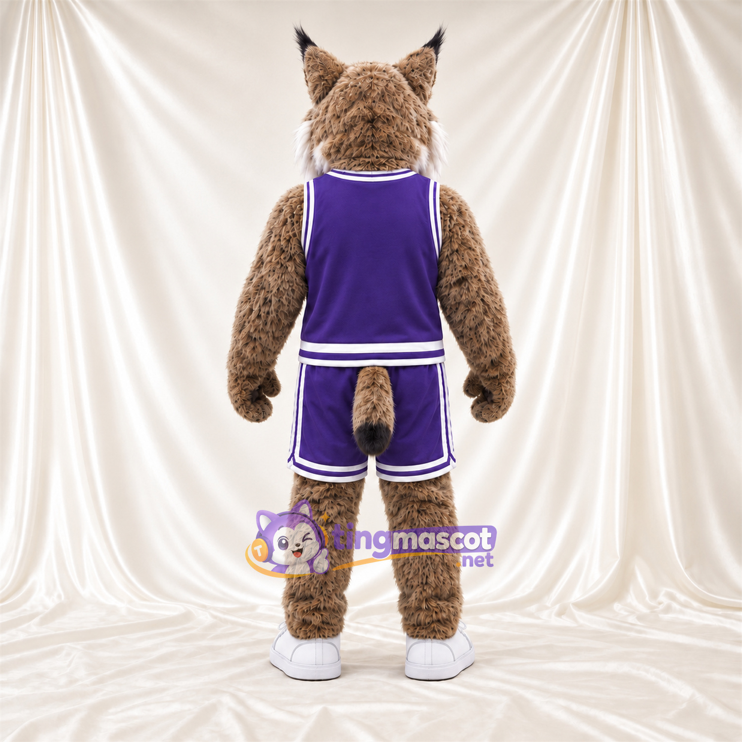 Maskottchenkostüm Rotluchs – braun – Basketballtrikot (violett) Maskottchenkostüm Rotluchs – braun – Basketballtrikot (violett)