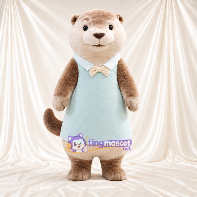 Costume de mascotte Loutre – brun clair – Robe (bleu clair); Nœud papillon (blanc) Costume de mascotte Loutre – brun clair – Robe (bleu clair); Nœud papillon (blanc)