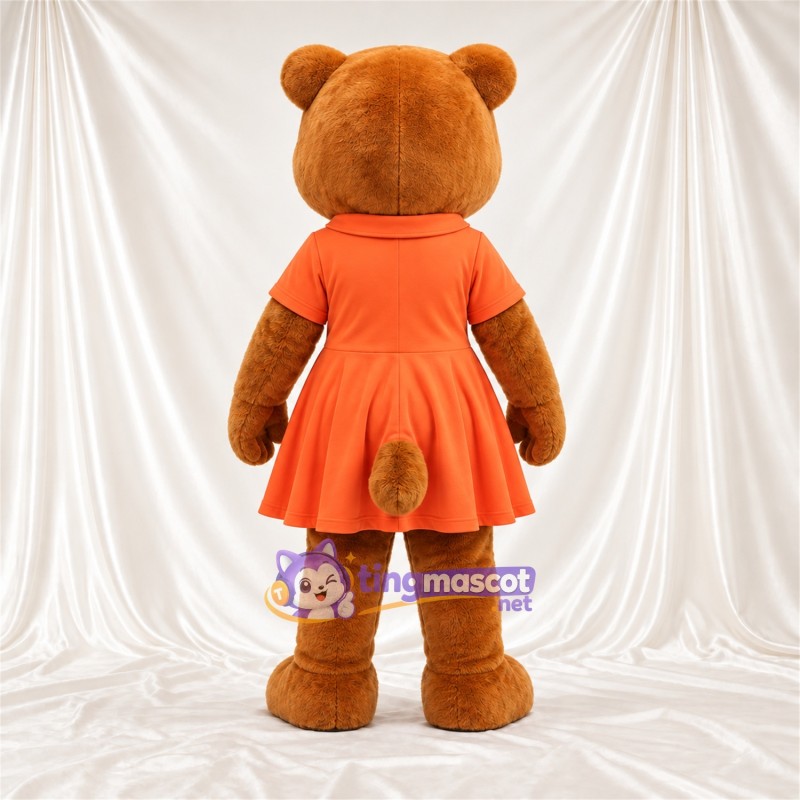 Maskottchenkostüm Bär – braun – Kleid (orange) Maskottchenkostüm Bär – braun – Kleid (orange)