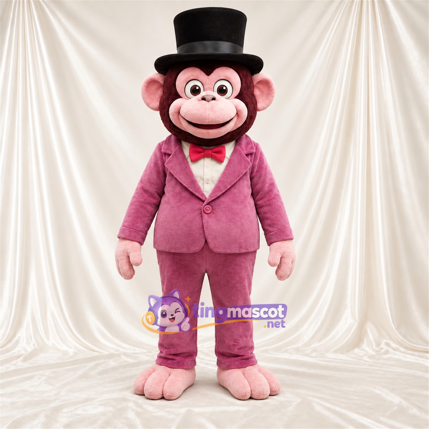 Maskottchenkostüm Affe – braun – Anzug (rosa); Fliege (rot) Maskottchenkostüm Affe – braun – Anzug (rosa); Fliege (rot)