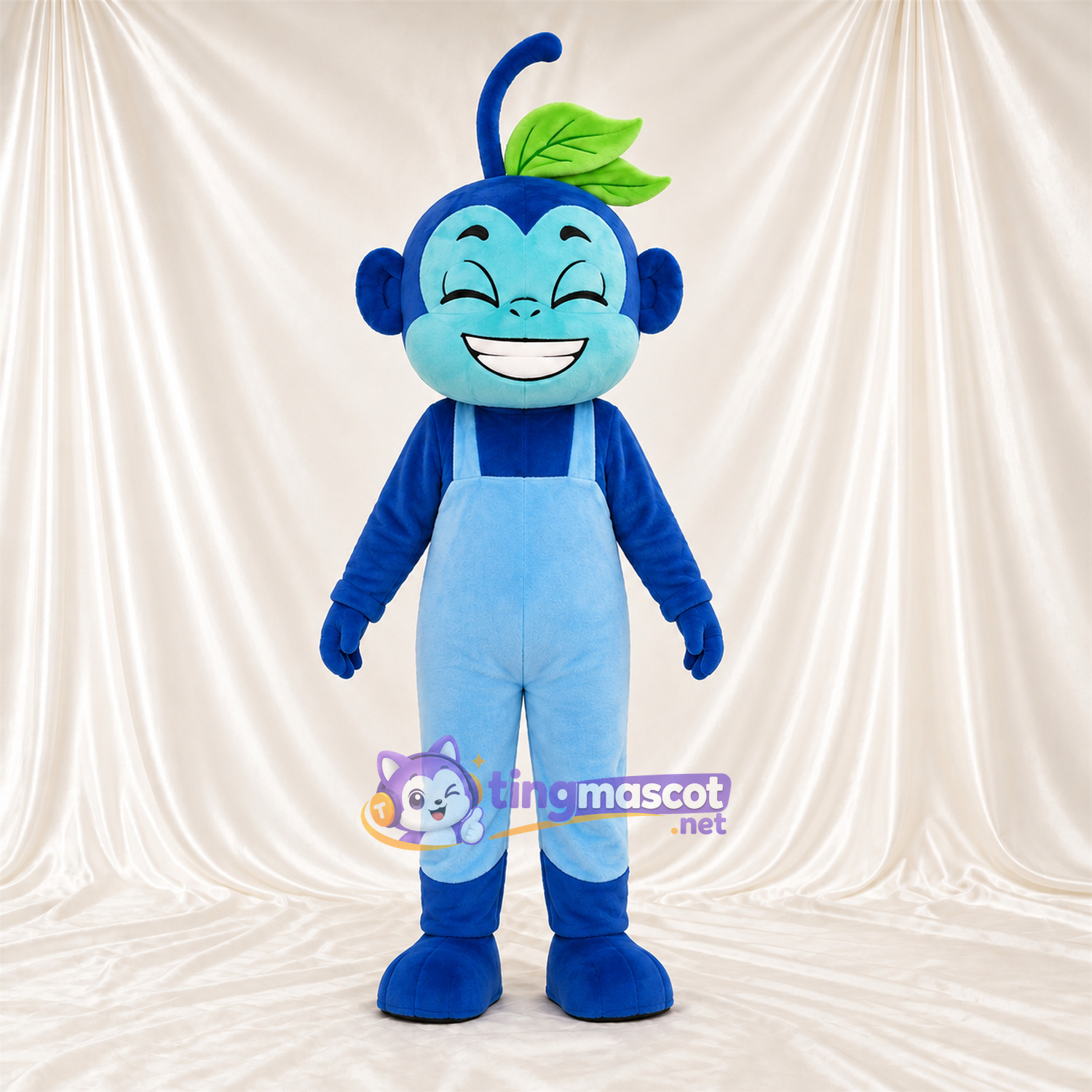 Maskottchenkostüm Affe – blau – Latzhose (hellblau); Breites Zahngrinsen Maskottchenkostüm Affe – blau – Latzhose (hellblau); Breites Zahngrinsen