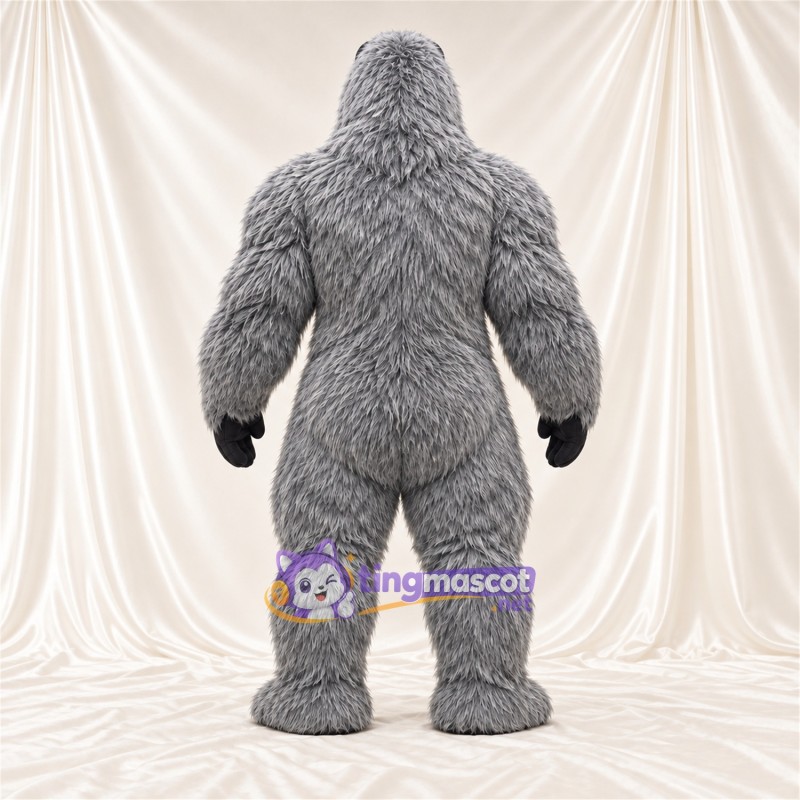 Maskottchenkostüm Gorilla – grau – Muskelbrust (schwarz); Zottelfell Maskottchenkostüm Gorilla – grau – Muskelbrust (schwarz); Zottelfell