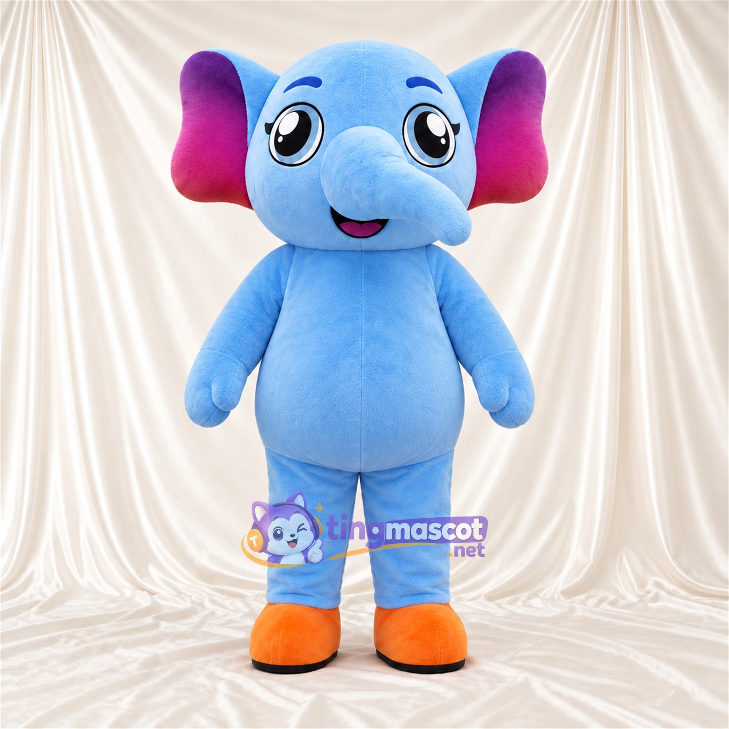 Maskottchenkostüm Elefant – blau – Ohreninnenseiten (violett); Füße (orange) Maskottchenkostüm Elefant – blau – Ohreninnenseiten (violett); Füße (orange)