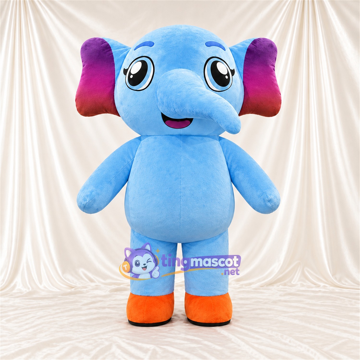 Maskottchenkostüm Elefant – blau – Ohreninnenseiten (violett); Füße (orange) Maskottchenkostüm Elefant – blau – Ohreninnenseiten (violett); Füße (orange)
