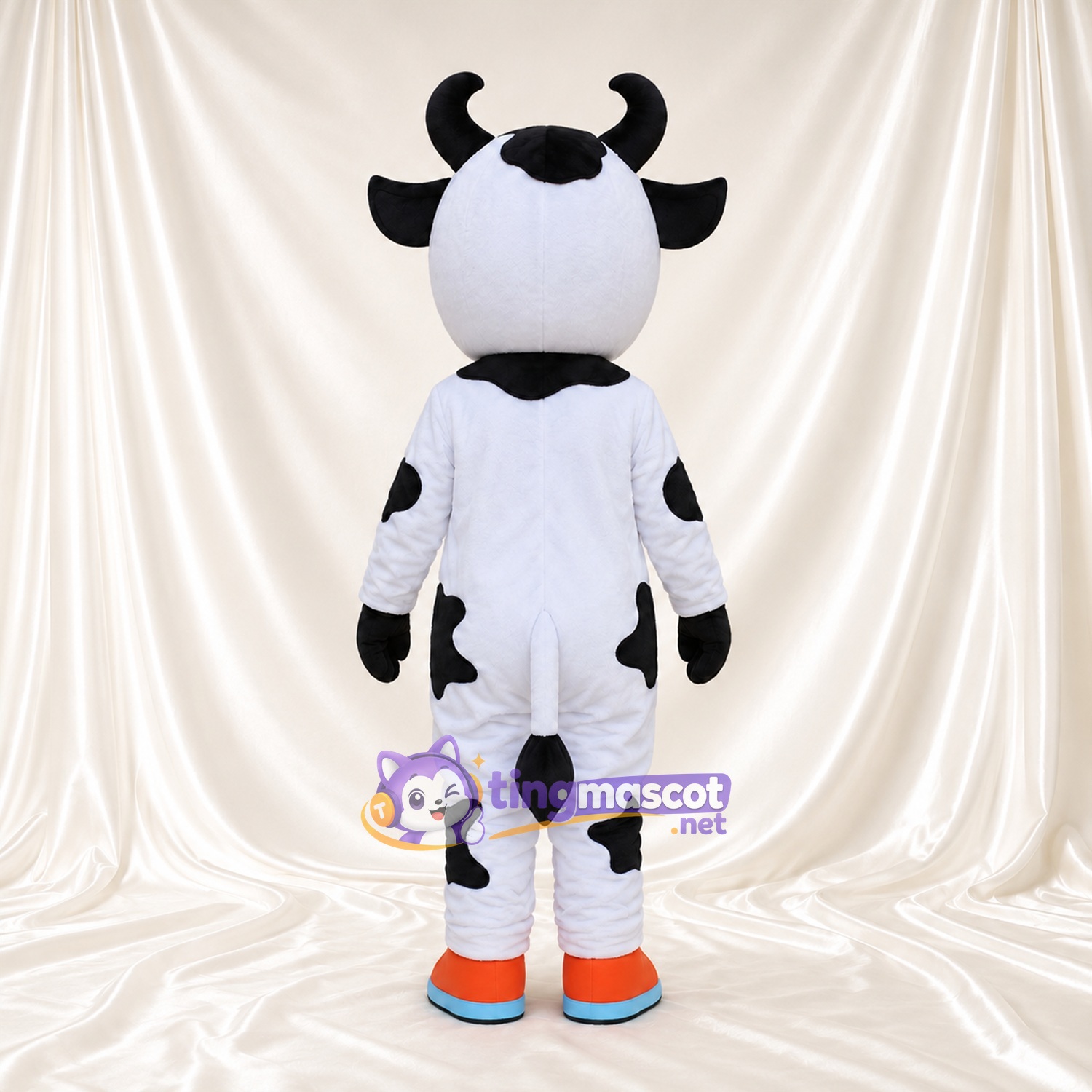 Black and White Cow Mascot Costume - Blue Eyes and Orange and Blue Shoes Black and White Cow Mascot Costume - Blue Eyes and Orange and Blue Shoes