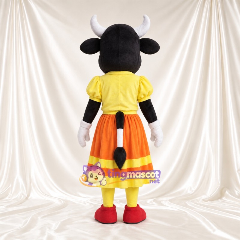 Costume de mascotte Vache – noir / blanc – Chemisier (jaune); Jupe (orange) Costume de mascotte Vache – noir / blanc – Chemisier (jaune); Jupe (orange)