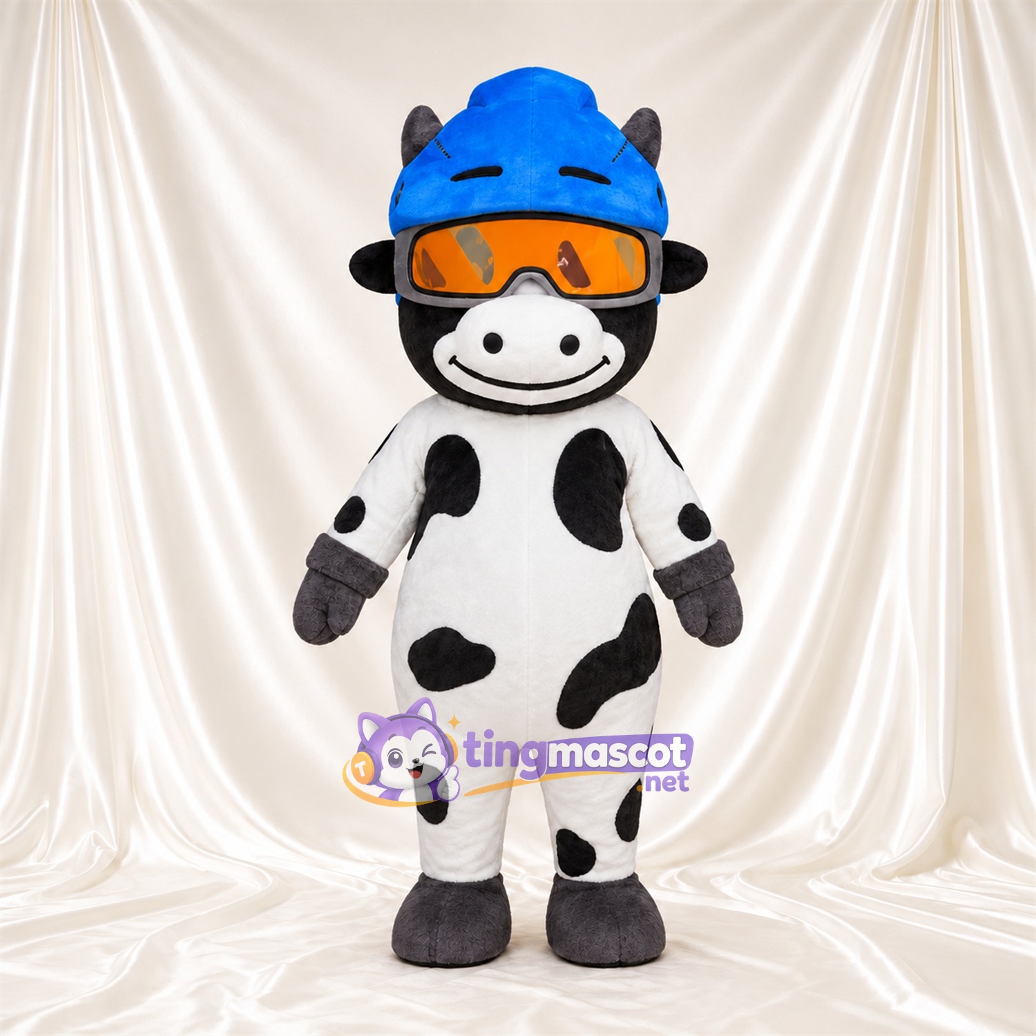 Black and White Cow Mascot Costume - Blue Helmet Orange Goggles Black and White Cow Mascot Costume - Blue Helmet Orange Goggles