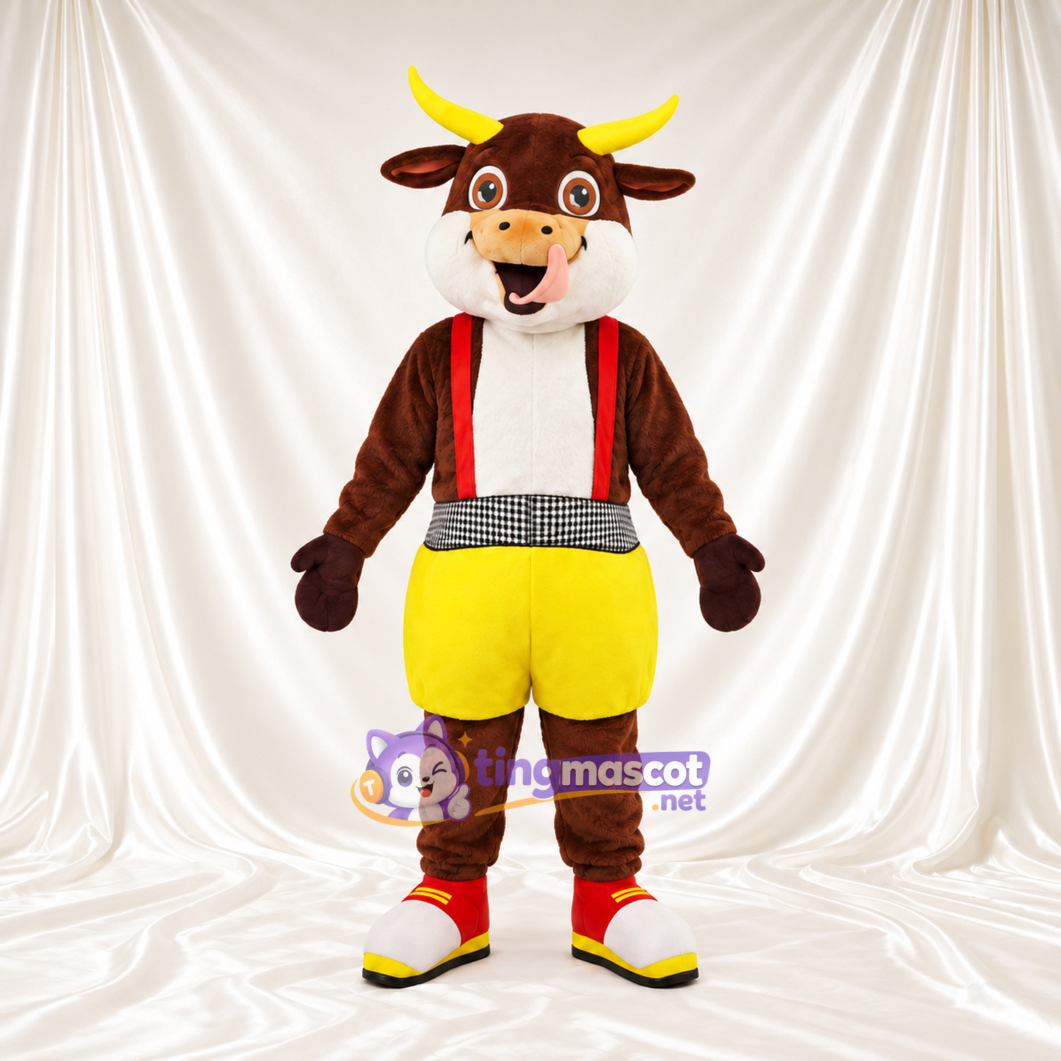 Costume de mascotte Vache – marron – Bretelles (rouge); Short (jaune) Costume de mascotte Vache – marron – Bretelles (rouge); Short (jaune)