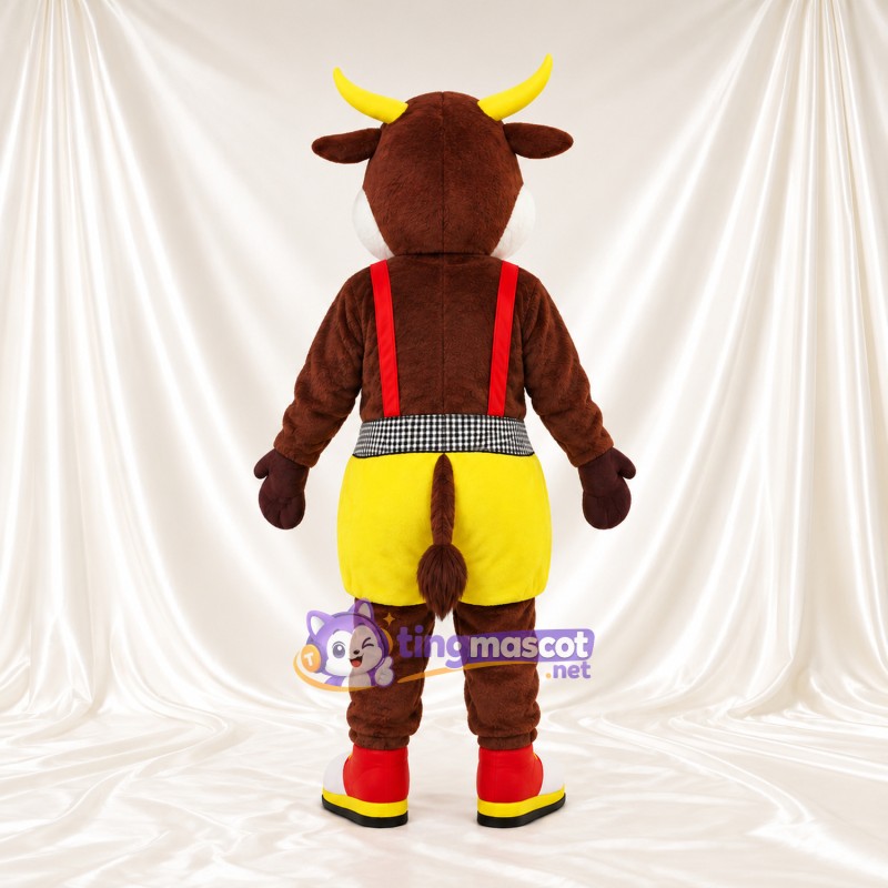 Costume de mascotte Vache – marron – Bretelles (rouge); Short (jaune) Costume de mascotte Vache – marron – Bretelles (rouge); Short (jaune)