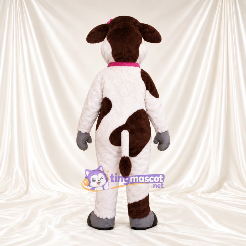 Costume de mascotte Vache – marron / blanc – Collier à clochette (rose) Costume de mascotte Vache – marron / blanc – Collier à clochette (rose)