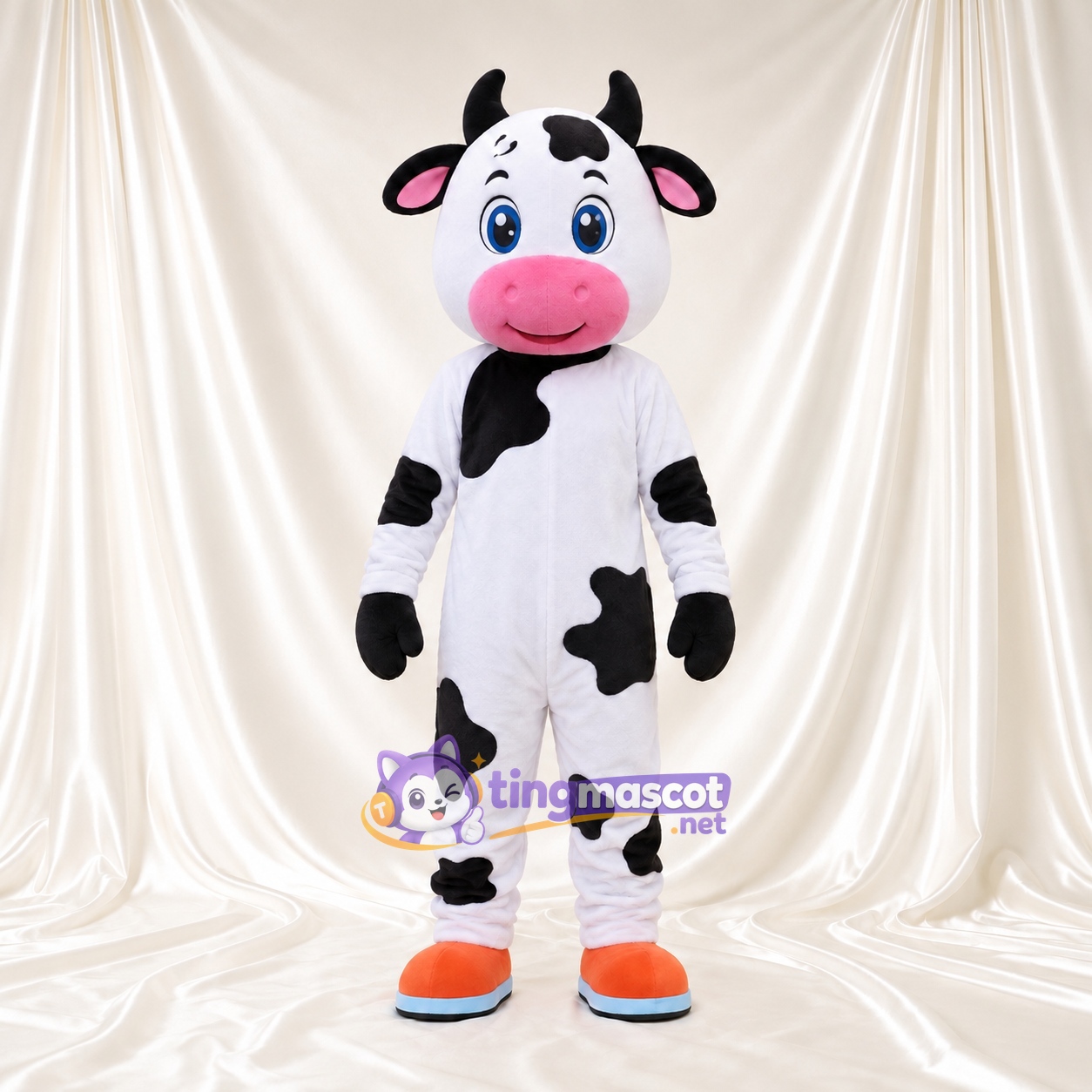 Black and White Cow Mascot Costume - Blue Eyes and Orange and Blue Shoes Black and White Cow Mascot Costume - Blue Eyes and Orange and Blue Shoes