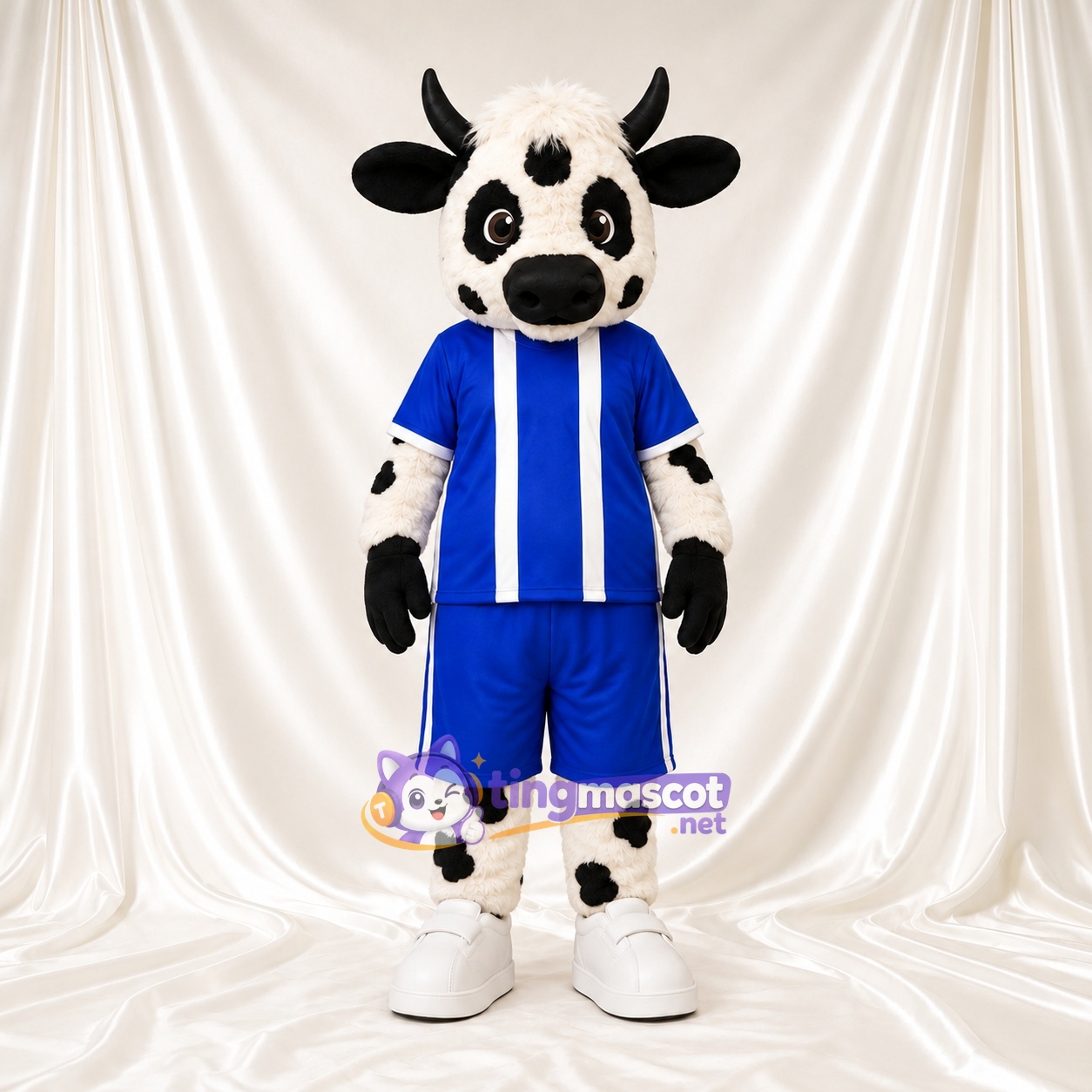 Black and White Cow Mascot Costume - Blue Sports Uniform Black and White Cow Mascot Costume - Blue Sports Uniform