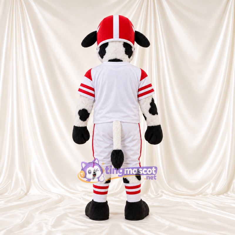 Black and White Cow Mascot Costume - White Football Uniform and Red Helmet, Black Floppy Ears and Black Hooves Black and White Cow Mascot Costume - White Football Uniform and Red Helmet, Black Floppy Ears and Black Hooves