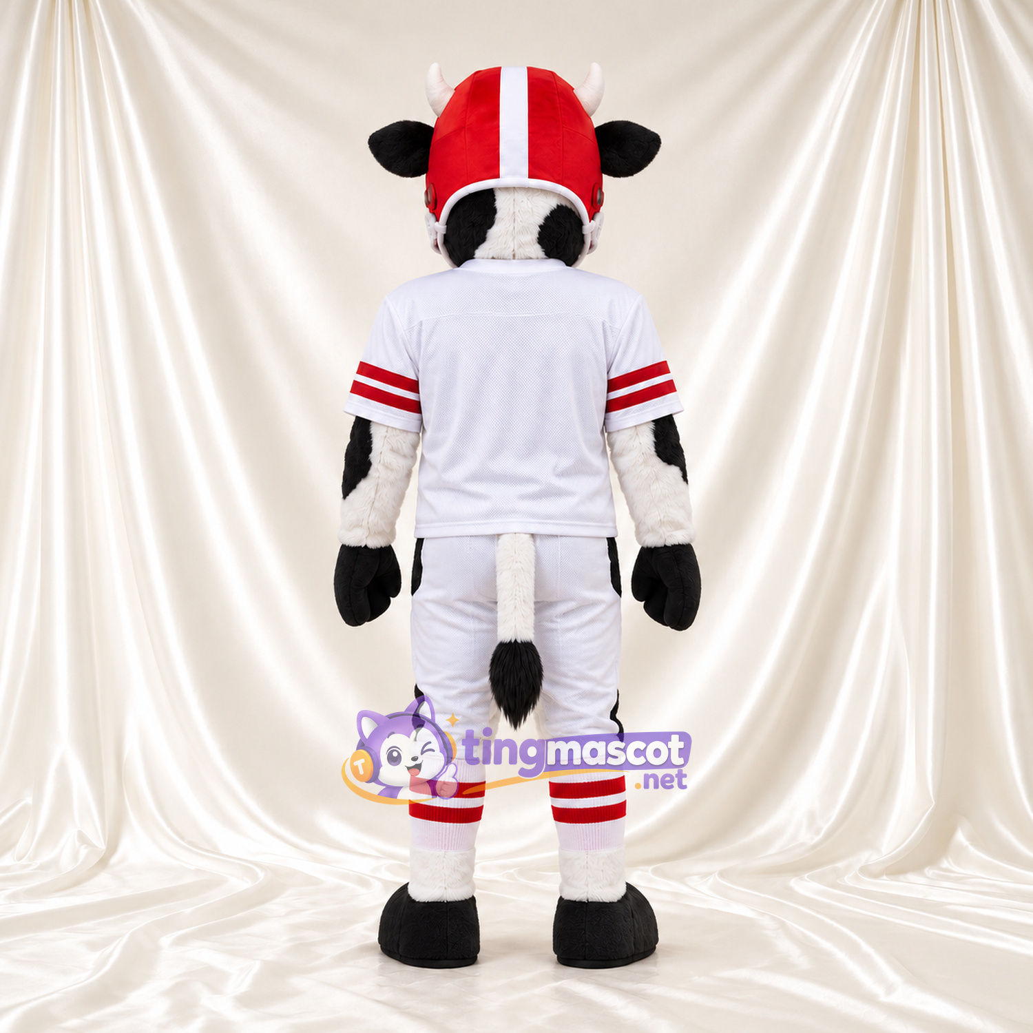 Black and White Cow Mascot Costume - White Football Uniform and Red Helmet, Pink Inner Ears and Black Hooves Black and White Cow Mascot Costume - White Football Uniform and Red Helmet, Pink Inner Ears and Black Hooves