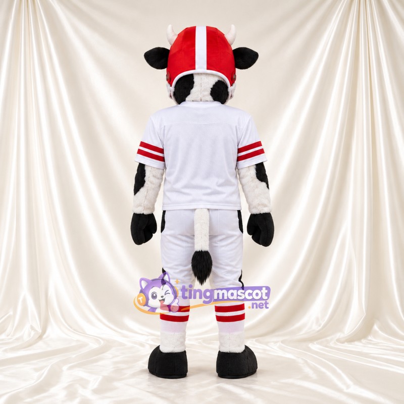 Black and White Cow Mascot Costume - White Football Uniform and Red Helmet, Pink Inner Ears and Black Hooves Black and White Cow Mascot Costume - White Football Uniform and Red Helmet, Pink Inner Ears and Black Hooves