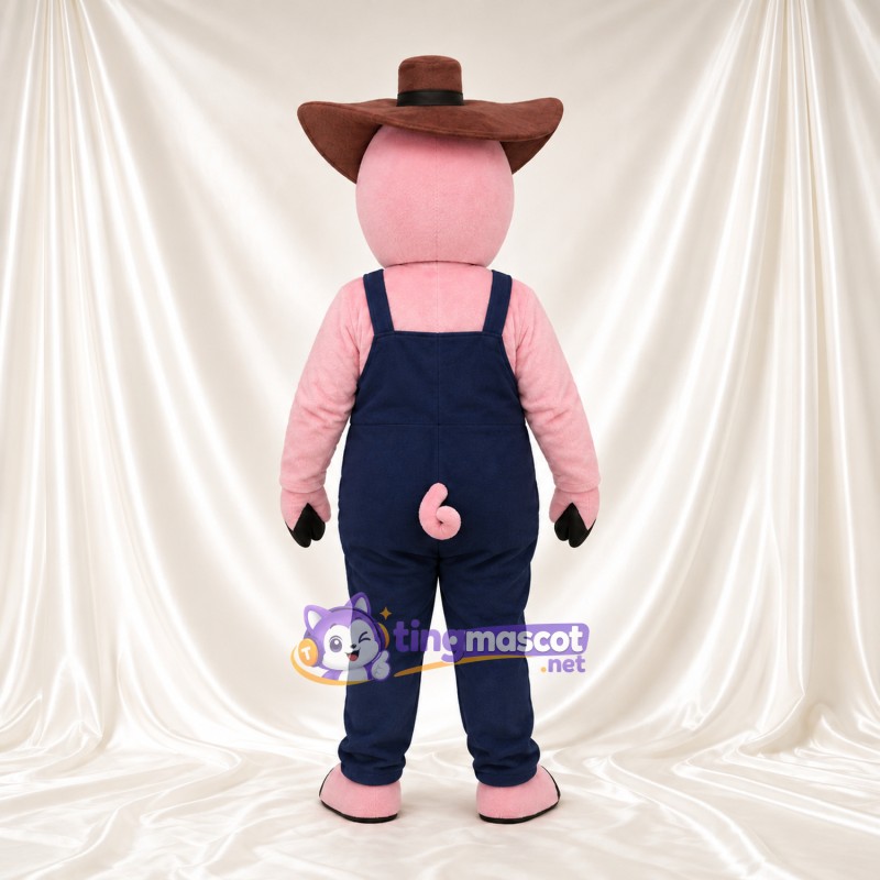 Costume de mascotte Cochon – rose – Chapeau de cowboy (marron); Salopette (bleu marine) Costume de mascotte Cochon – rose – Chapeau de cowboy (marron); Salopette (bleu marine)