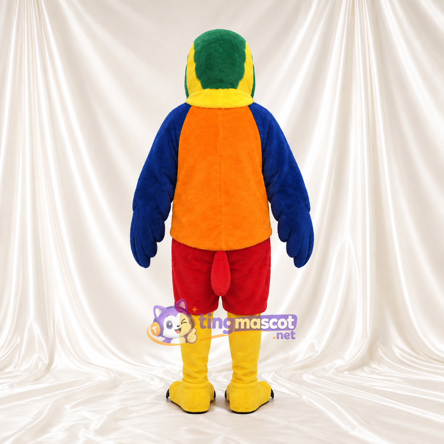 Maskottchenkostüm Papagei – blau / gelb – Hemd (orange); Shorts (rot) Maskottchenkostüm Papagei – blau / gelb – Hemd (orange); Shorts (rot)
