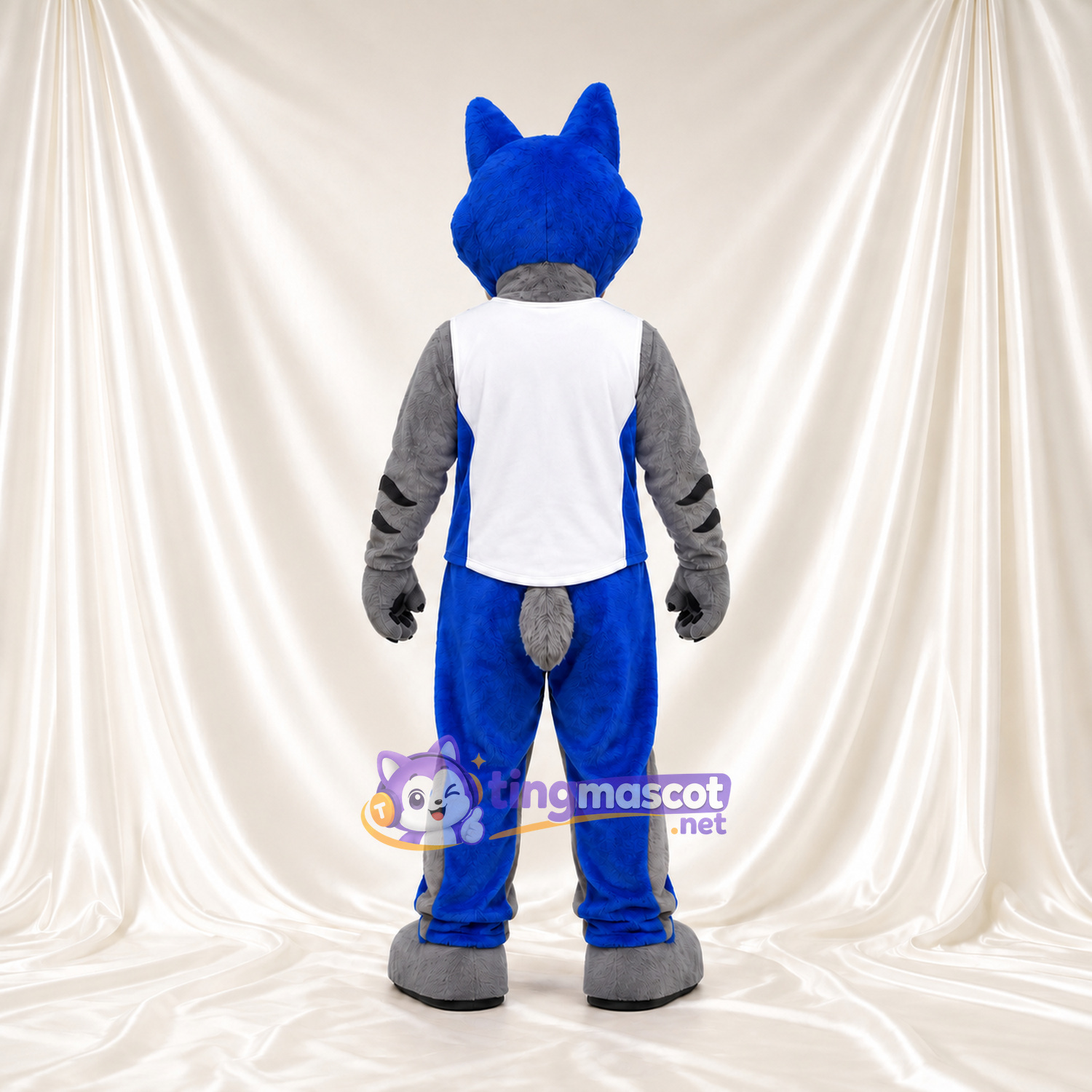 Costume de mascotte Loup – bleu / gris – Gilet de sport (blanc); Pantalon (bleu) Costume de mascotte Loup – bleu / gris – Gilet de sport (blanc); Pantalon (bleu)
