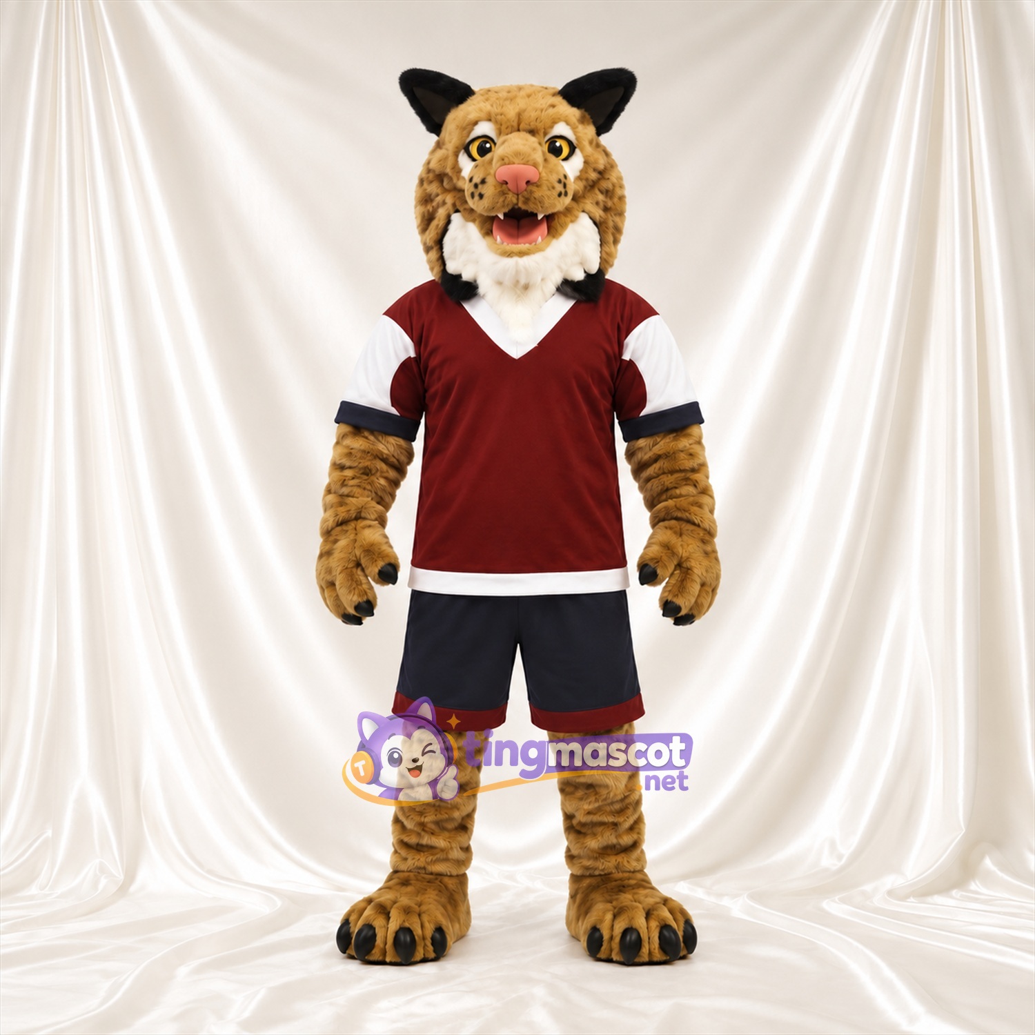 Costume de mascotte Lynx – brun clair – Maillot de sport (bordeaux); Short (noir) Costume de mascotte Lynx – brun clair – Maillot de sport (bordeaux); Short (noir)