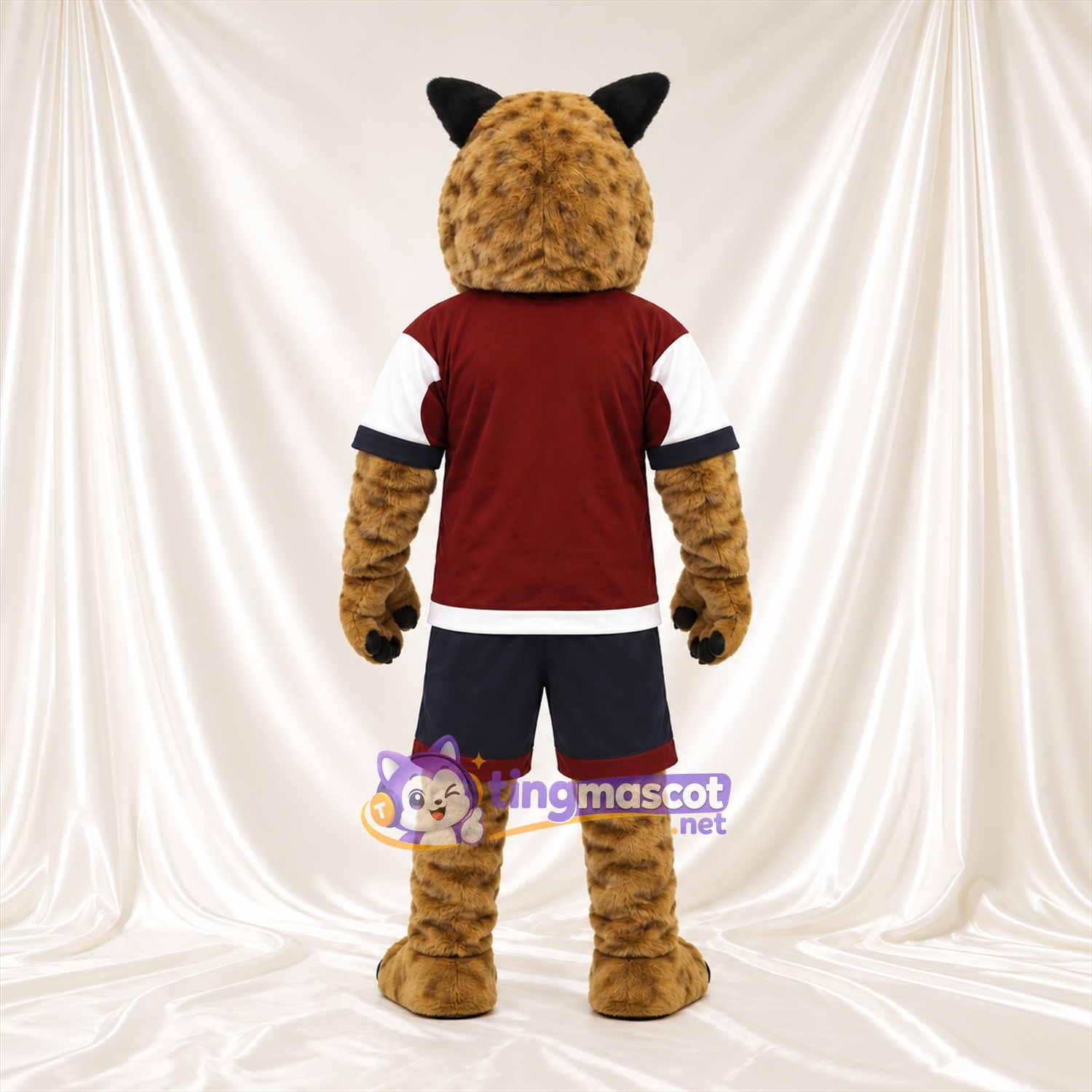 Costume de mascotte Lynx – brun clair – Maillot de sport (bordeaux); Short (noir) Costume de mascotte Lynx – brun clair – Maillot de sport (bordeaux); Short (noir)