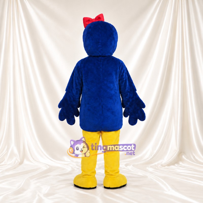 Costume de mascotte Oiseau – bleu / jaune – Nœud sur la tête (rouge) Costume de mascotte Oiseau – bleu / jaune – Nœud sur la tête (rouge)