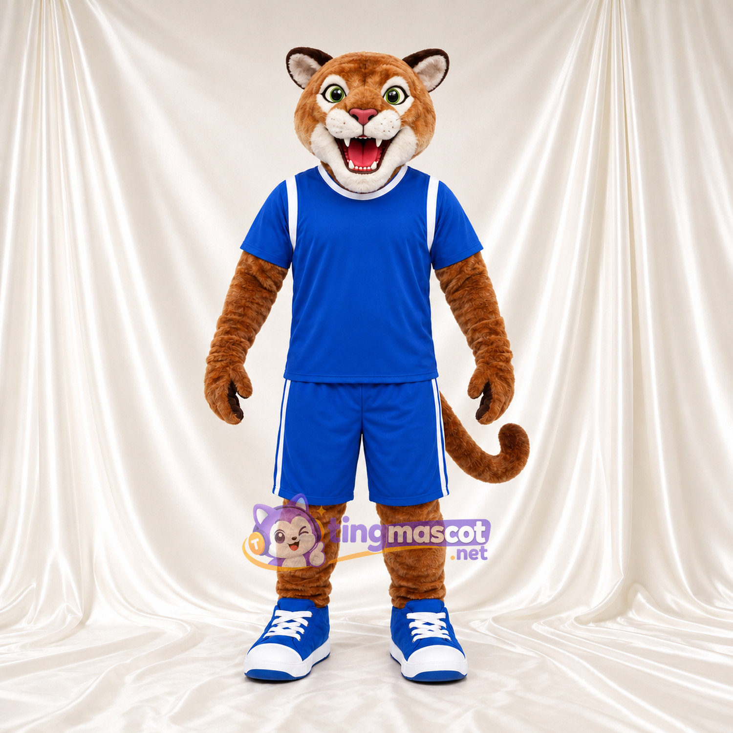 Brown Cougar Mascot Costume - Blue Sports Uniform and Blue Sneakers Brown Cougar Mascot Costume - Blue Sports Uniform and Blue Sneakers