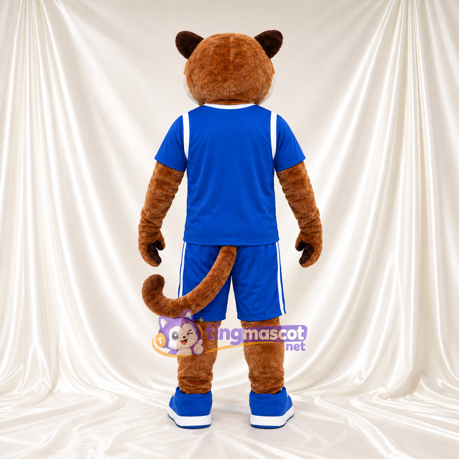Brown Cougar Mascot Costume - Blue Sports Uniform and Blue Sneakers Brown Cougar Mascot Costume - Blue Sports Uniform and Blue Sneakers