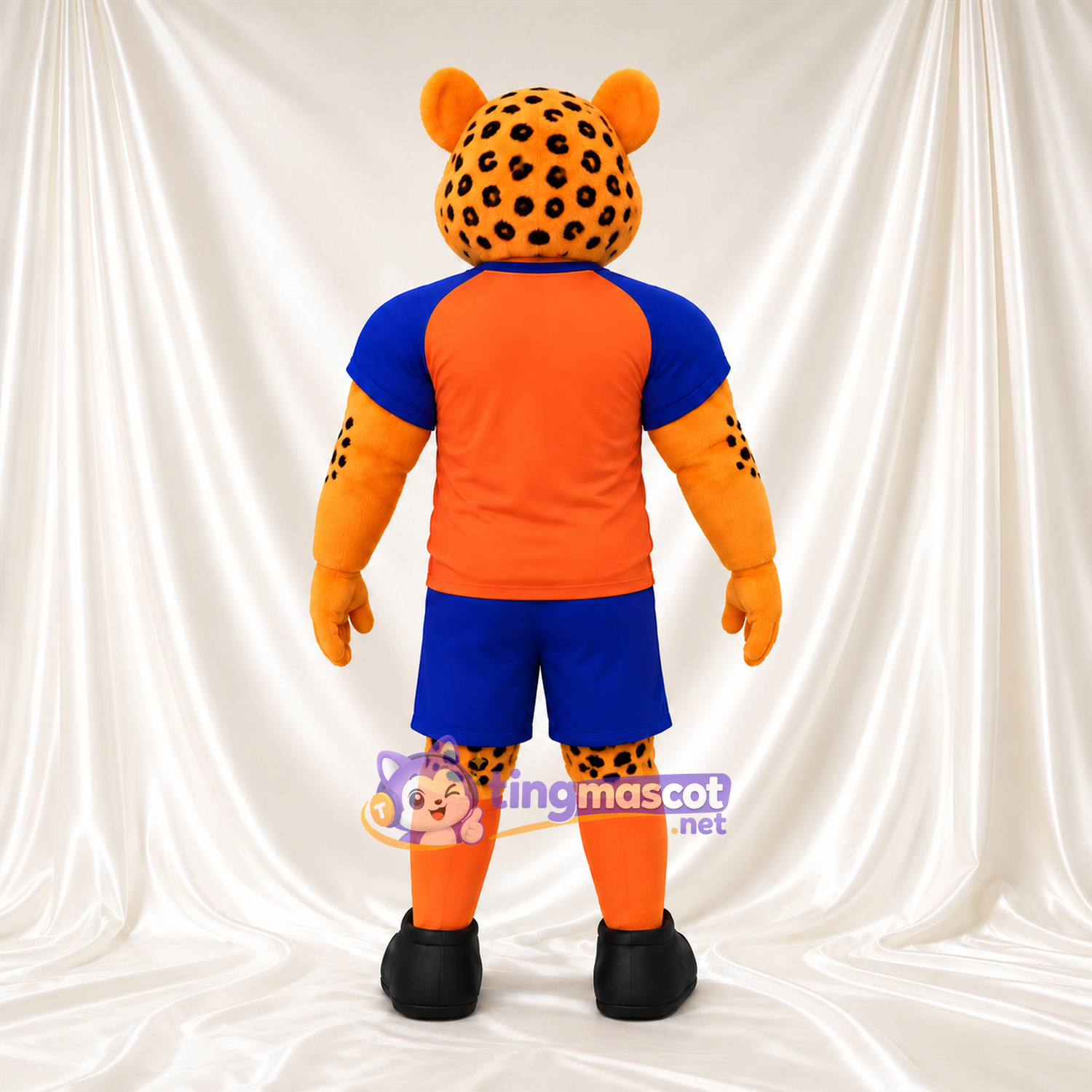 Costume de mascotte Léopard – orange – Maillot de sport (orange); Short (bleu) Costume de mascotte Léopard – orange – Maillot de sport (orange); Short (bleu)
