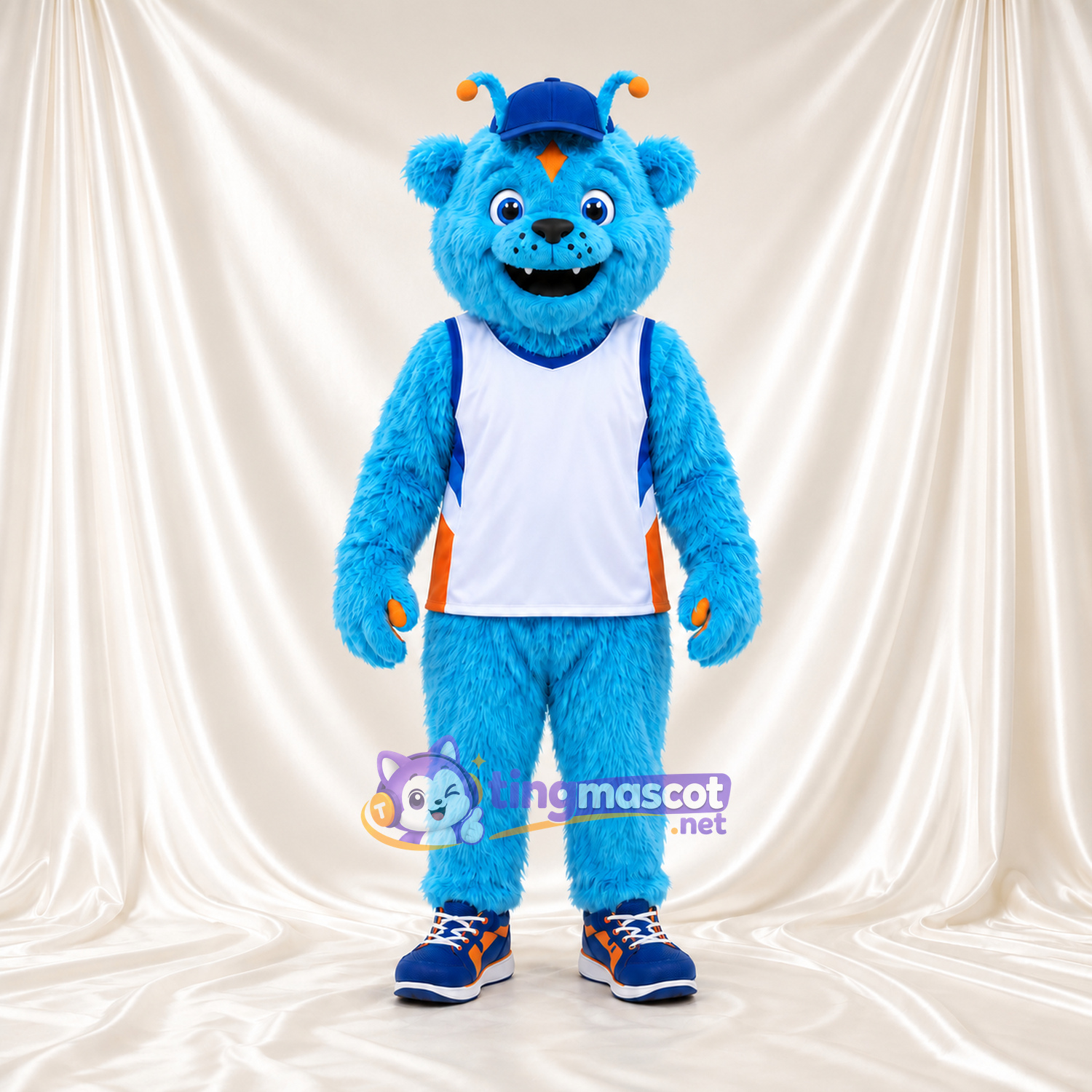 Costume de mascotte Monstre – bleu – Casquette (bleu); Haut (blanc, de sport) Costume de mascotte Monstre – bleu – Casquette (bleu); Haut (blanc, de sport)