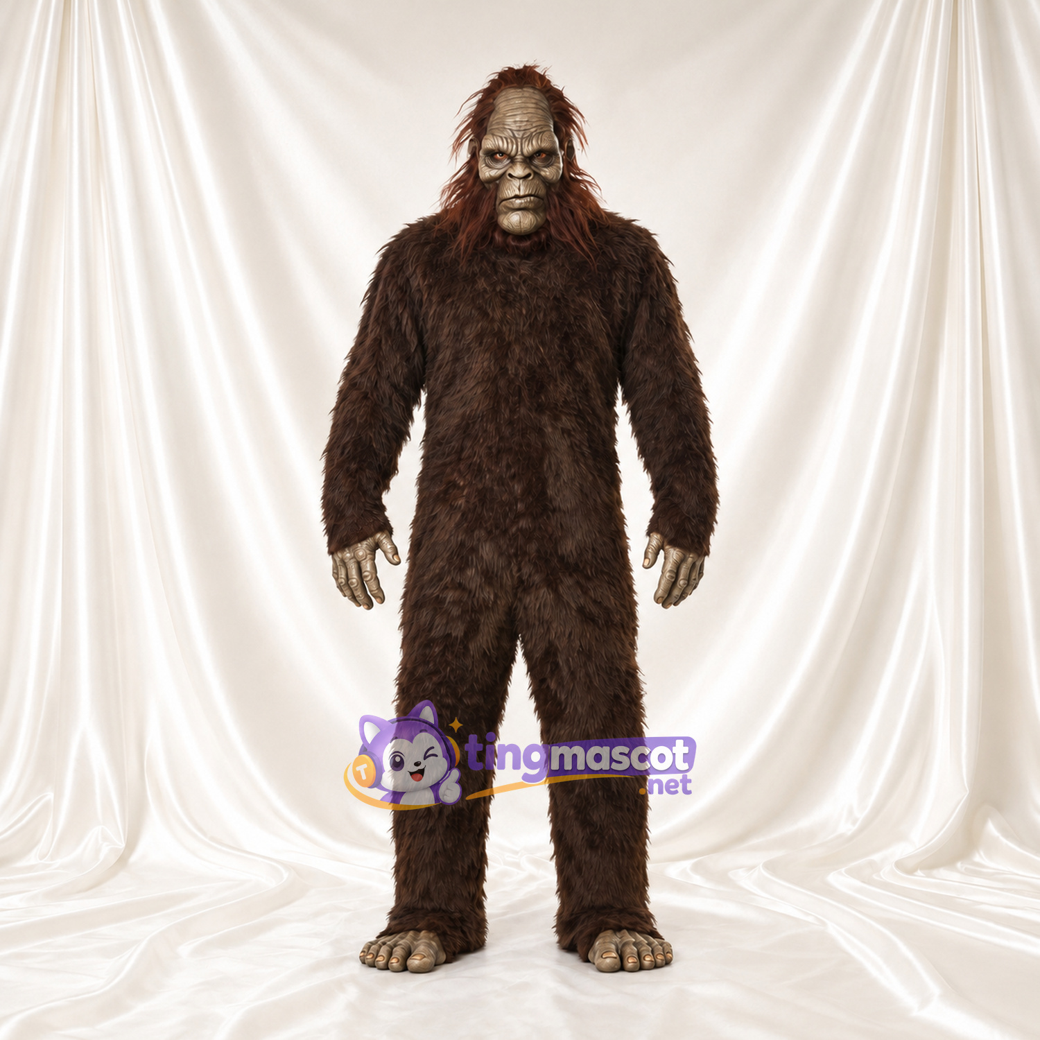 Costume de mascotte Bigfoot – marron – Fourrure hirsute (long); Visage (gris) Costume de mascotte Bigfoot – marron – Fourrure hirsute (long); Visage (gris)