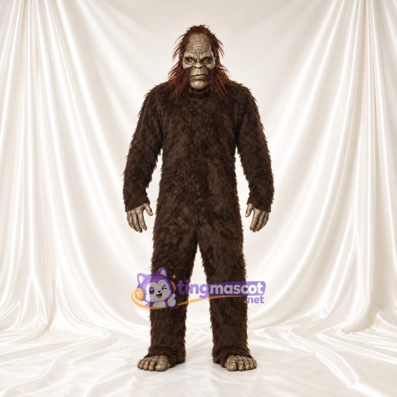 Costume de mascotte Bigfoot – marron – Fourrure hirsute (long); Visage (gris) Costume de mascotte Bigfoot – marron – Fourrure hirsute (long); Visage (gris)