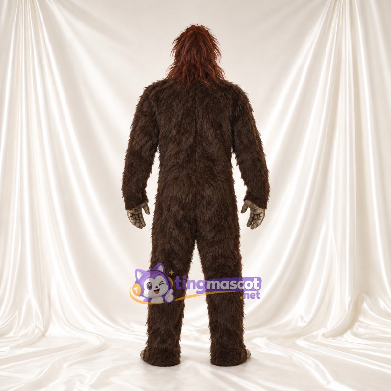 Costume de mascotte Bigfoot – marron – Fourrure hirsute (long); Visage (gris) Costume de mascotte Bigfoot – marron – Fourrure hirsute (long); Visage (gris)