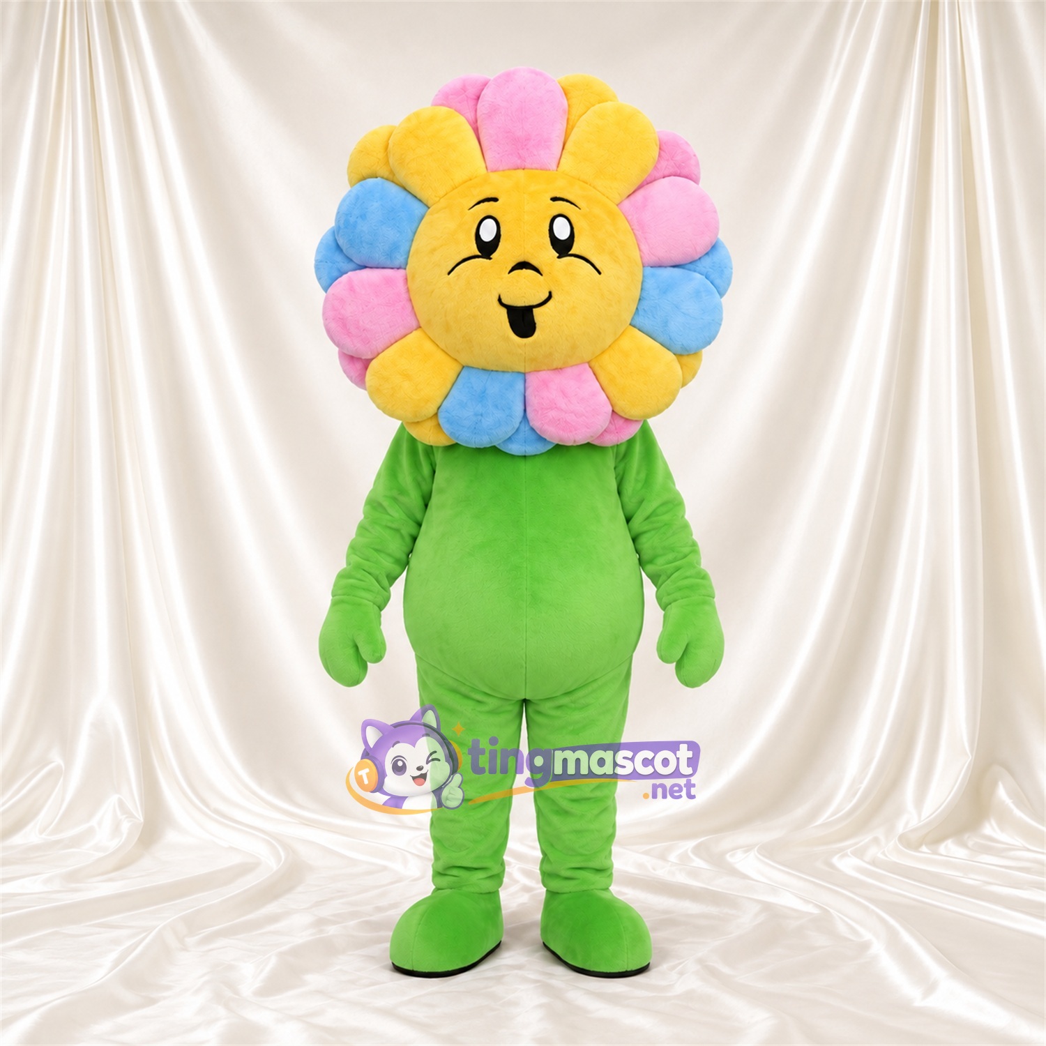 Maskottchenkostüm Blume – Regenbogenfarben – Gesicht (gelb); Körper (grün) Maskottchenkostüm Blume – Regenbogenfarben – Gesicht (gelb); Körper (grün)