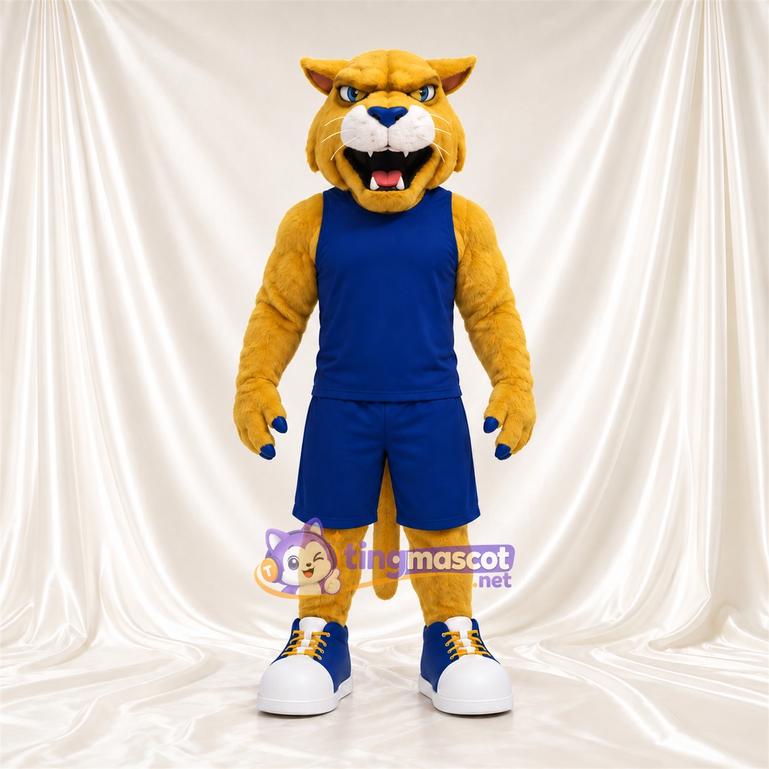 Costume de mascotte Chat sauvage – doré – Tenue de basket (bleu) Costume de mascotte Chat sauvage – doré – Tenue de basket (bleu)
